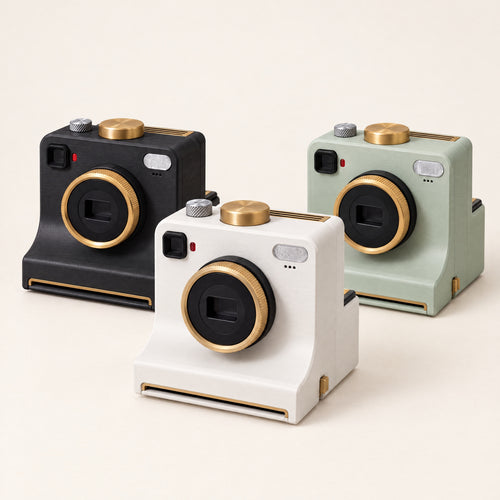 Plexa Coffee Art Camera in white, black and sage green on a warm ivory background.